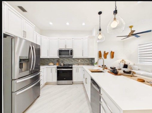 Kitchen & Island after the renovation at 10th Avenue Estate in Naples, Florida