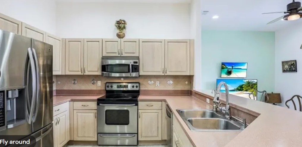 Kitchen & Island before the renovation at 10th Avenue Estate in Naples, Florida