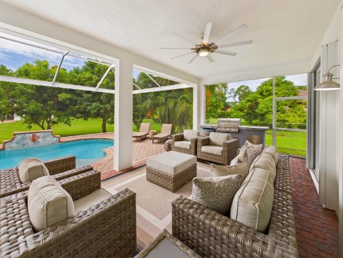 Screened Lanai & Pool after the renovation at 10th Avenue Estate in Naples, Florida